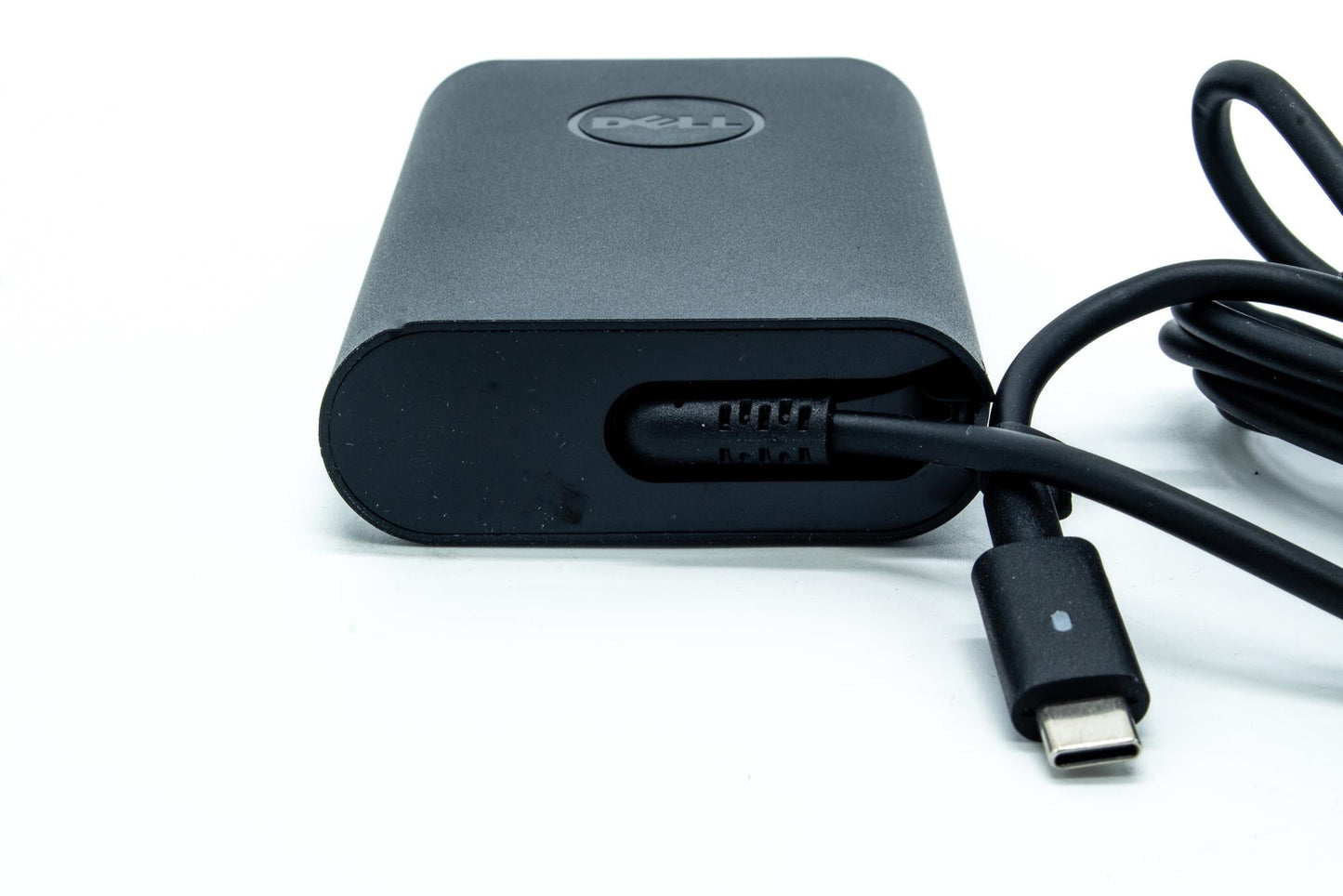 Dell 65W AC adapter with 19.5V output, USB Type-C connector, compatible with various Dell notebooks, indoor use only.