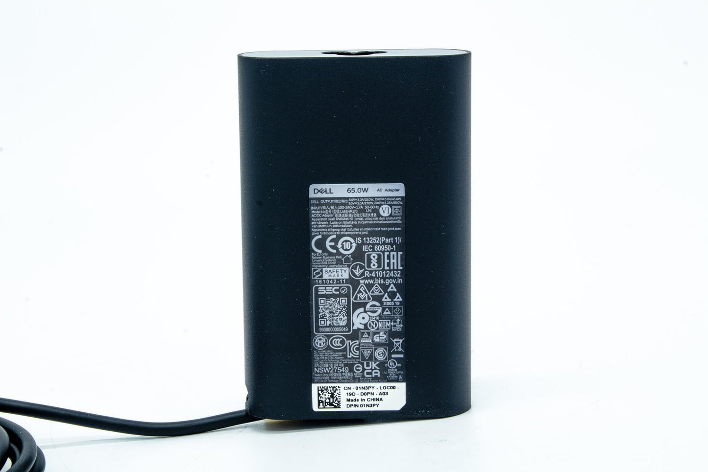 Dell 65W AC adapter with 19.5V output, USB Type-C connector, compatible with various Dell notebooks, indoor use only.